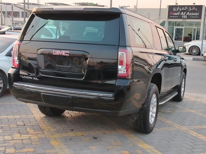 Подержанный GMC Yukon XL IV (GMT K2UG), 6.2 л, 2018 в Шардже от Al Helal Al Abyadh Used Cars Черный цвет. GCC | AUTO.AE