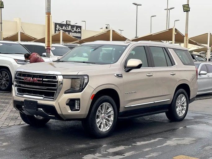 Подержанный GMC Yukon V Рестайлинг, 5.3 л, 2024 в Шардже от ASAL ALHAIBAH USED CARS Золотистый цвет. GCC | AUTO.AE