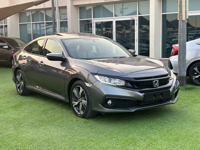 Used Honda Civic X, 1.6 l, 2020 in Sharjah by Almasar Used Cars, Grey color. GCC Specs | AUTO.AE