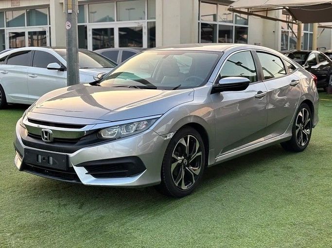 Used Honda Civic X, 1.6 l, 2018 in Sharjah by Almasar Used Cars, Silver color. GCC Specs | AUTO.AE
