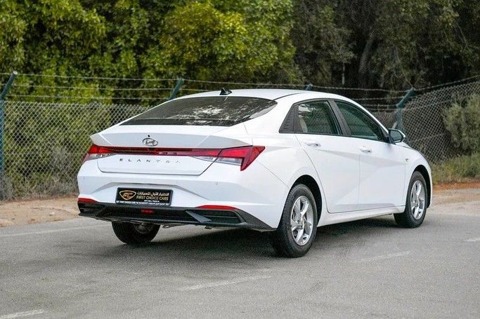 Used Hyundai Elantra VII (CN7) Facelift, 1.6 l, 2023 in Sharjah by First Choice Cars, White color. GCC Specs | AUTO.AE