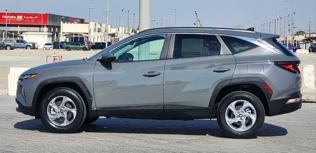 Подержанный Hyundai Tucson IV, 2.5 л, 2024 в Шардже от Nassem Al Sham Used Cars Серый цвет. Американская | AUTO.AE