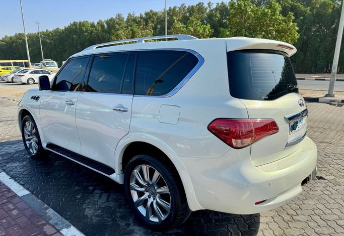 Used Infiniti QX56 II, 5.6 l, 2013 in Sharjah by DCB Cars, White color. GCC Specs | AUTO.AE