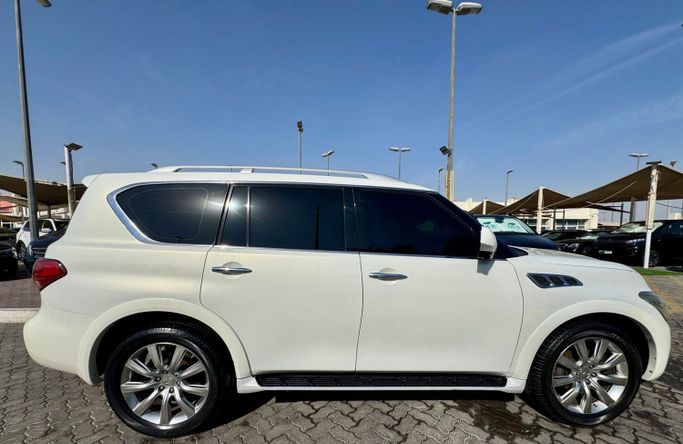 Used Infiniti QX56 II, 5.6 l, 2013 in Sharjah by DCB Cars, White color. GCC Specs | AUTO.AE