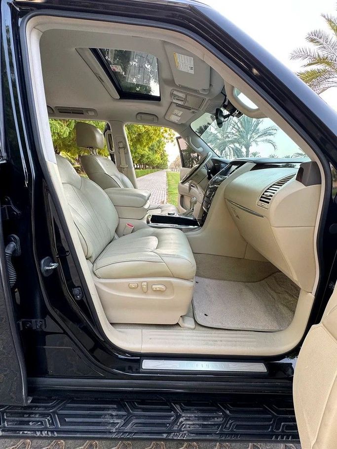 Подержанный Infiniti QX80 I Рестайлинг, 5.6 л, 2014 в Шардже от Taj Al Impratoor Used Cars Черный цвет. GCC | AUTO.AE