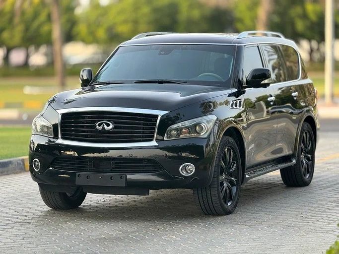 Подержанный Infiniti QX80 I Рестайлинг, 5.6 л, 2014 в Шардже от Taj Al Impratoor Used Cars Черный цвет. GCC | AUTO.AE