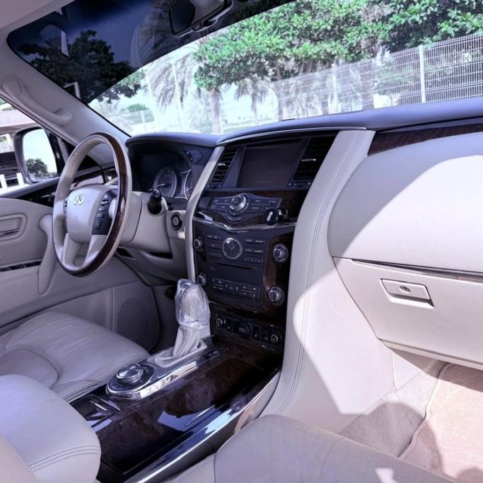 Used Infiniti QX80 I, 5.6 l, 2014 in Sharjah by Sarmad Cars, White color. Other | AUTO.AE