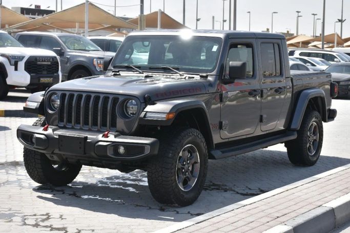 Подержанный Jeep Gladiator II (JT), 3.6 л, 2022 в Шардже от Alfaris Used Cars Серый цвет. Other | AUTO.AE