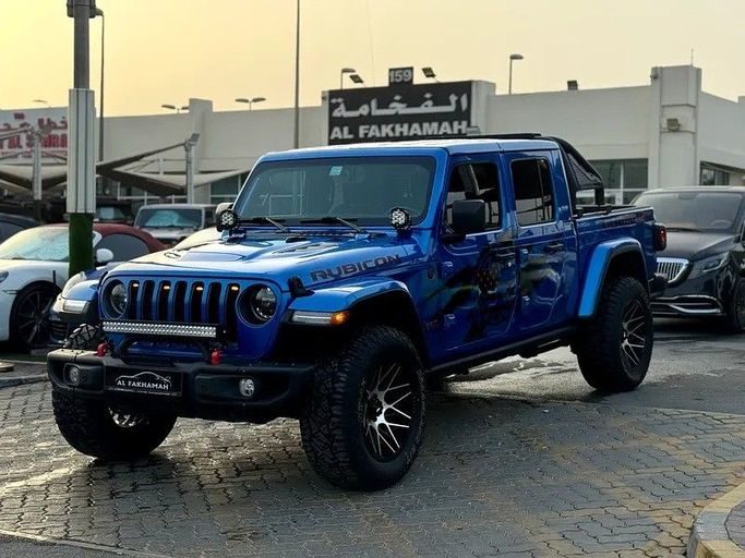 Подержанный Jeep Gladiator II (JT), 3.6 л, 2021 в Шардже от Al Fakhamah Used Cars Синий цвет. Американская | AUTO.AE