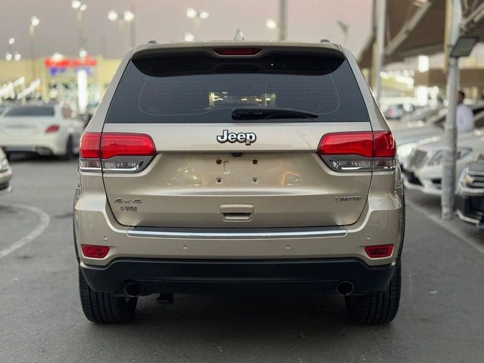 Подержанный Jeep Grand Cherokee IV (WK2) Рестайлинг, 5.7 л, 2014 в Шардже от Titanium Used Cars Золотистый цвет. GCC | AUTO.AE