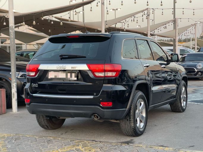 Подержанный Jeep Grand Cherokee IV (WK2) Рестайлинг, 3.6 л, 2014 в Шардже от Al Suraj Al Muneer Used Cars Черный цвет. GCC | AUTO.AE