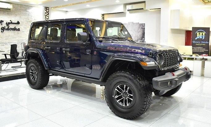 New Jeep Wrangler IV (JL) Facelift, 2.0 l, 2025 in Sharjah by Honey Gidosha Used Cars Tr., Blue color.  | AUTO.AE