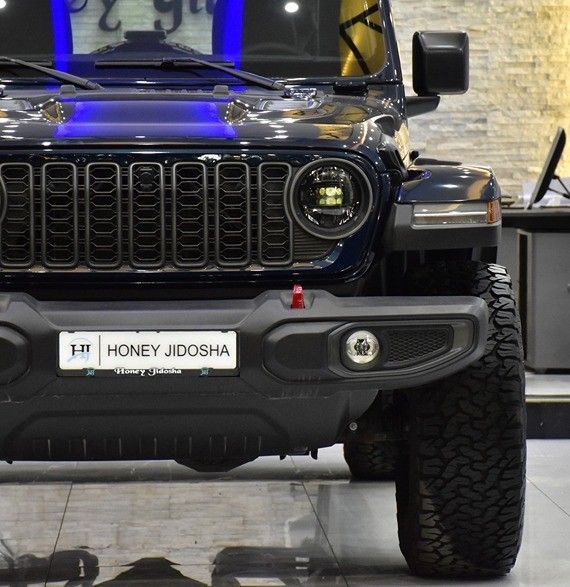 New Jeep Wrangler IV (JL) Facelift, 2.0 l, 2025 in Sharjah by Honey Gidosha Used Cars Tr., Blue color.  | AUTO.AE