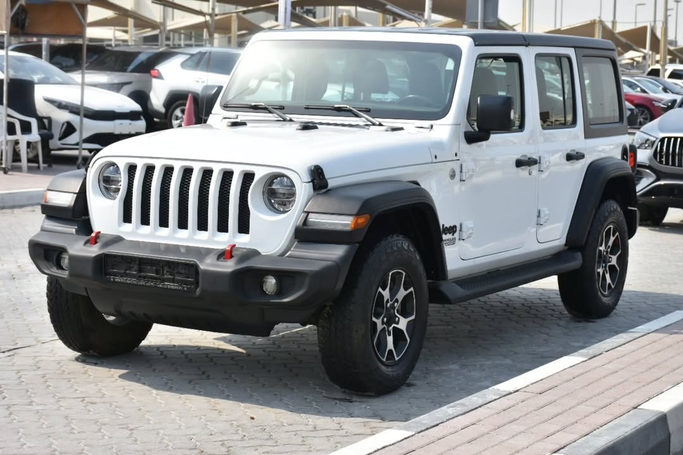 Подержанный Jeep Wrangler IV (JL), 3.6 л, 2021 в Шардже от Alfaris Used Cars Белый цвет. GCC | AUTO.AE