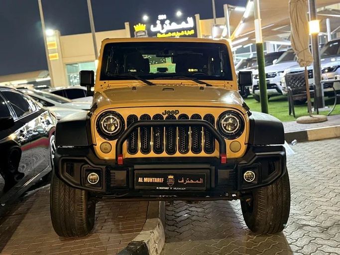Подержанный Jeep Wrangler III (JK), 3.6 л, 2014 в Шардже от Al Muhtaref Used Cars Желтый цвет. GCC | AUTO.AE