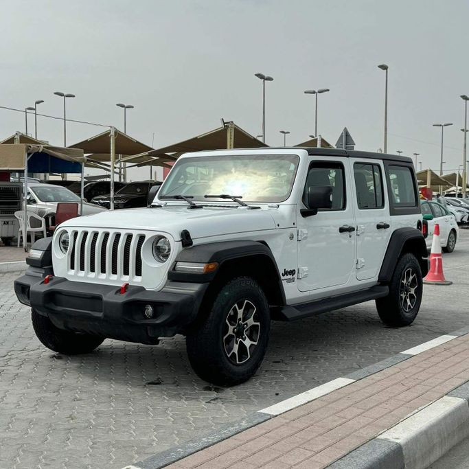 Подержанный Jeep Wrangler IV (JL), 3.6 л, 2021 в Шардже от Alfaris Used Cars Белый цвет. Other | AUTO.AE