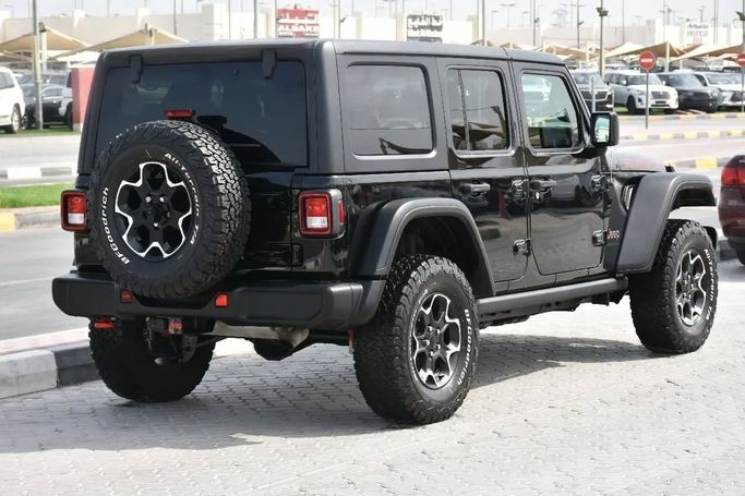 Подержанный Jeep Wrangler IV (JL), 2.0 л, 2023 в Шардже от Alfaris Used Cars Черный цвет. Other | AUTO.AE