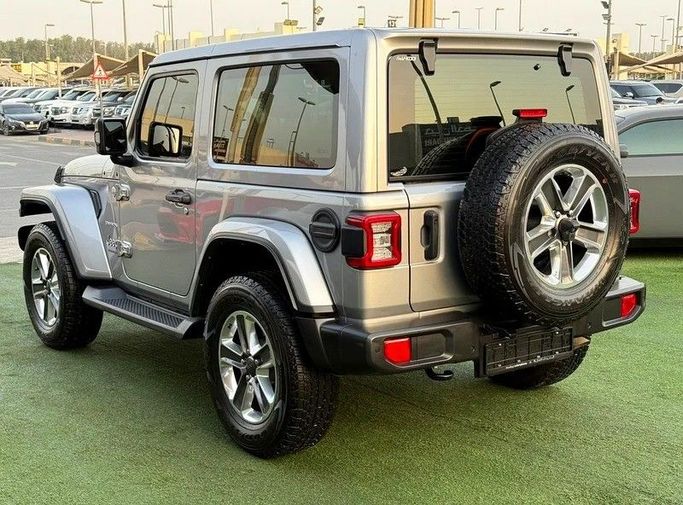 Подержанный Jeep Wrangler IV (JL), 3.6 л, 2021 в Шардже от Hayan Alkhudari Used Cars Серый цвет. GCC | AUTO.AE