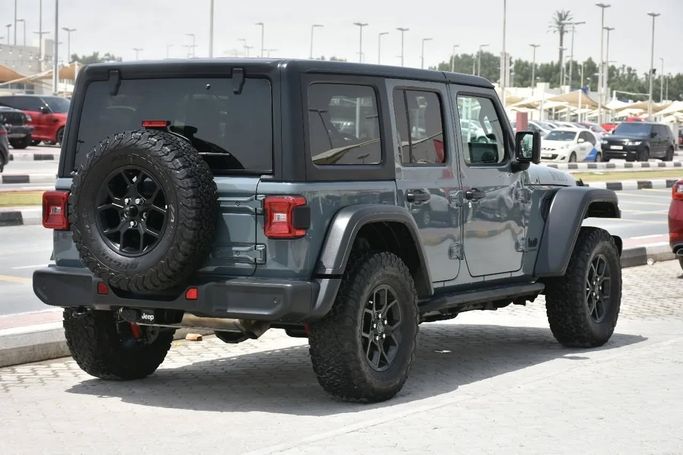 Подержанный Jeep Wrangler IV (JL) Рестайлинг, 2.0 л, 2024 в Шардже от Alfaris Used Cars Серый цвет. Other | AUTO.AE