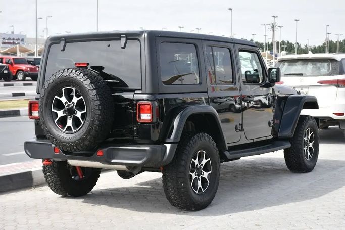 Подержанный Jeep Wrangler IV (JL), 3.6 л, 2023 в Шардже от Alfaris Used Cars Черный цвет. Other | AUTO.AE