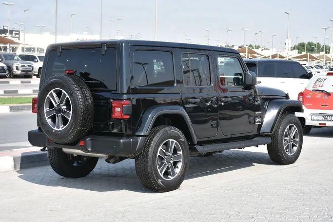Подержанный Jeep Wrangler IV (JL), 2.0 л, 2023 в Шардже от Alfaris Used Cars Черный цвет. Other | AUTO.AE