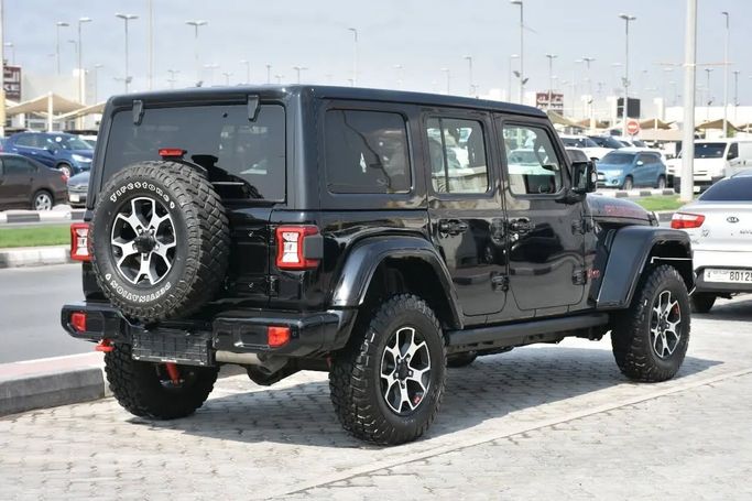 Подержанный Jeep Wrangler IV (JL), 2.0 л, 2023 в Шардже от Alfaris Used Cars Черный цвет. Other | AUTO.AE