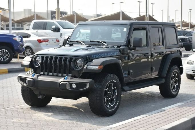Подержанный Jeep Wrangler IV (JL), 2.0 л, 2022 в Шардже от Alfaris Used Cars Черный цвет. Other | AUTO.AE