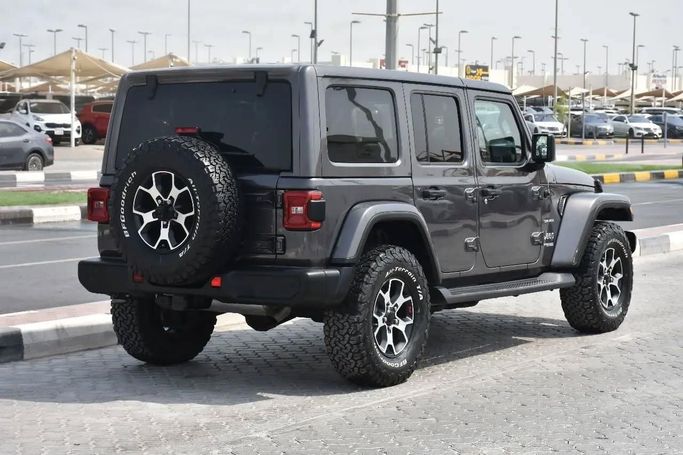 Подержанный Jeep Wrangler IV (JL), 3.6 л, 2022 в Шардже от Alfaris Used Cars Серый цвет. Other | AUTO.AE