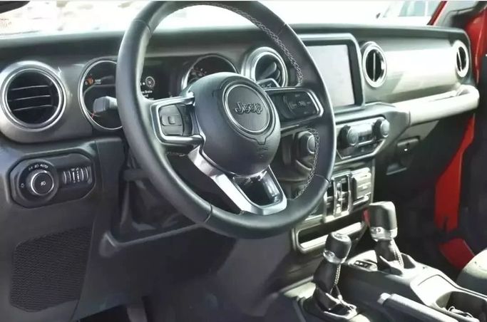 Used Jeep Wrangler IV (JL), 3.6 l, 2022 in Sharjah by Alfaris Used Cars, Red color. Other | AUTO.AE