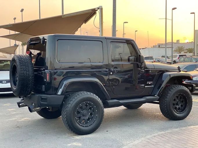Подержанный Jeep Wrangler III (JK), 3.8 л, 2017 в Шардже от Al Saqr Al Mutaliq Черный цвет. GCC | AUTO.AE