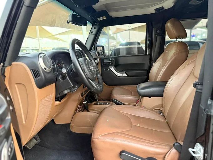 Подержанный Jeep Wrangler III (JK), 3.6 л, 2017 в Шардже от Hamsat Waad Черный цвет. GCC | AUTO.AE