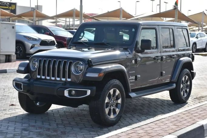 Подержанный Jeep Wrangler IV (JL), 3.6 л, 2019 в Шардже от Alfaris Used Cars Серый цвет. Other | AUTO.AE