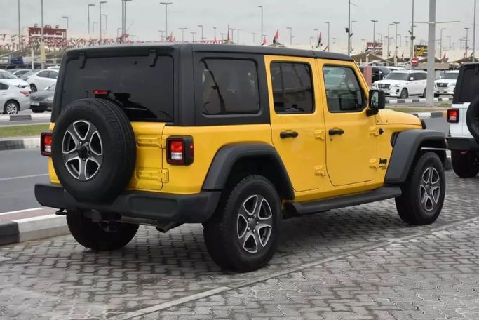Подержанный Jeep Wrangler IV (JL), 2.0 л, 2021 в Шардже от Alfaris Used Cars Желтый цвет. Other | AUTO.AE