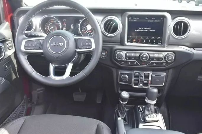 Подержанный Jeep Wrangler IV (JL), 2.0 л, 2022 в Шардже от Alfaris Used Cars Красный цвет. Other | AUTO.AE