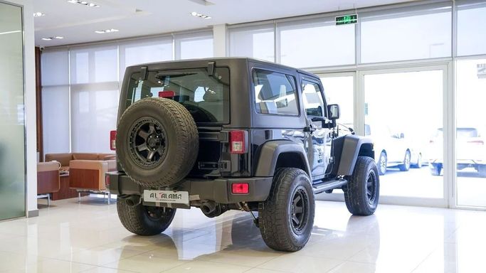 Подержанный Jeep Wrangler III (JK), 3.6 л, 2013 в Шардже от Alsalama Motors Черный цвет. GCC | AUTO.AE