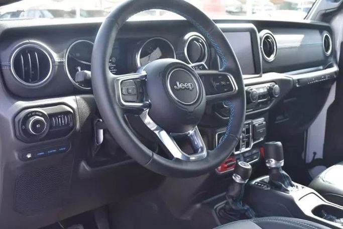 Used Jeep Wrangler IV (JL), 2.0 l, 2022 in Sharjah by Alfaris Used Cars, White color. Other | AUTO.AE