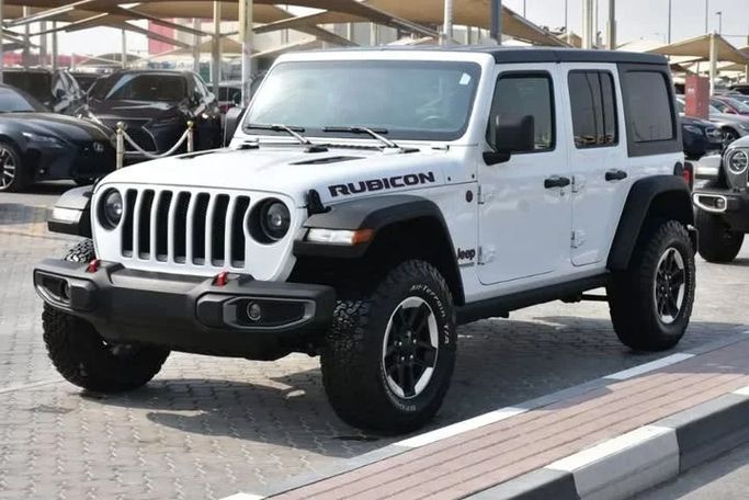 Used Jeep Wrangler IV (JL), 2.0 l, 2021 in Sharjah by Alfaris Used Cars, White color. Other | AUTO.AE