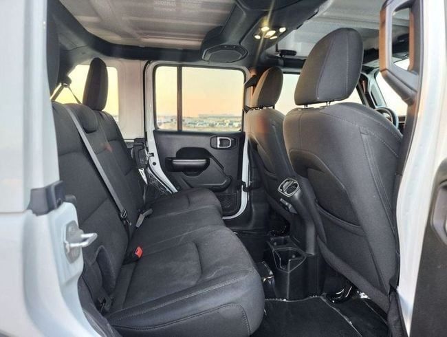 Used Jeep Wrangler IV (JL), 2.0 l, 2021 in Sharjah by Nassem Al Sham Used Cars, White color. American Specs | AUTO.AE