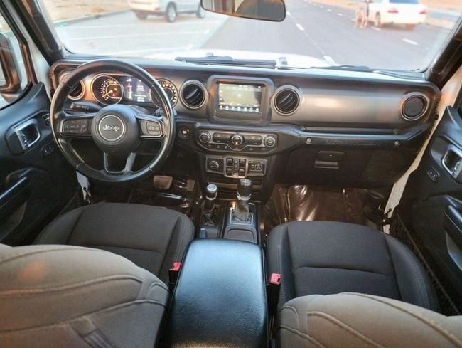 Used Jeep Wrangler IV (JL), 2.0 l, 2021 in Sharjah by Nassem Al Sham Used Cars, White color. American Specs | AUTO.AE