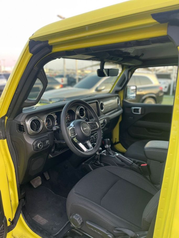 Used Jeep Wrangler IV (JL), 2.0 l, 2023 in Sharjah by Alsabah Used Cars, Yellow color. Canadian Specs | AUTO.AE