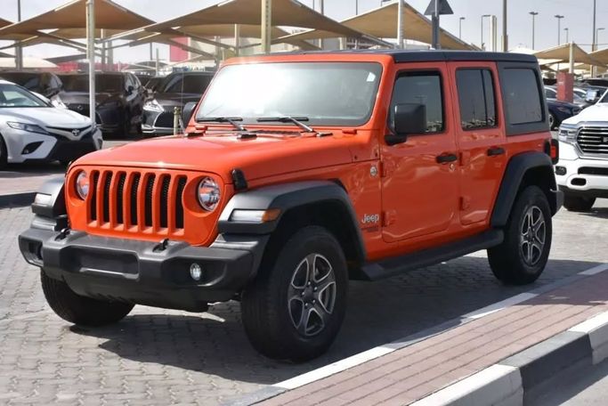 Подержанный Jeep Wrangler IV (JL), 3.6 л, 2019 в Шардже от Alfaris Used Cars Оранжевый цвет. Other | AUTO.AE