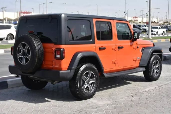 Подержанный Jeep Wrangler IV (JL), 3.6 л, 2019 в Шардже от Alfaris Used Cars Оранжевый цвет. Other | AUTO.AE