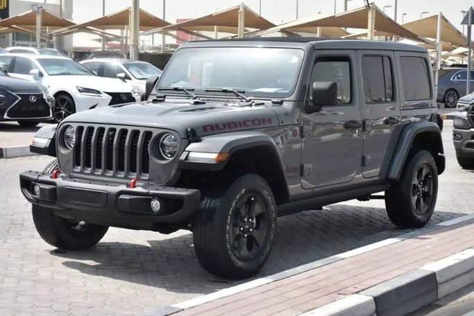 Подержанный Jeep Wrangler IV (JL), 2.0 л, 2021 в Шардже от Alfaris Used Cars Серый цвет. Other | AUTO.AE