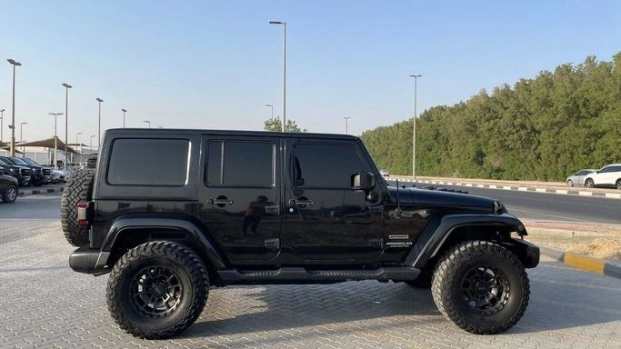 Подержанный Jeep Wrangler III (JK), 3.6 л, 2015 в Шардже от Halla Cars Черный цвет. Американская | AUTO.AE