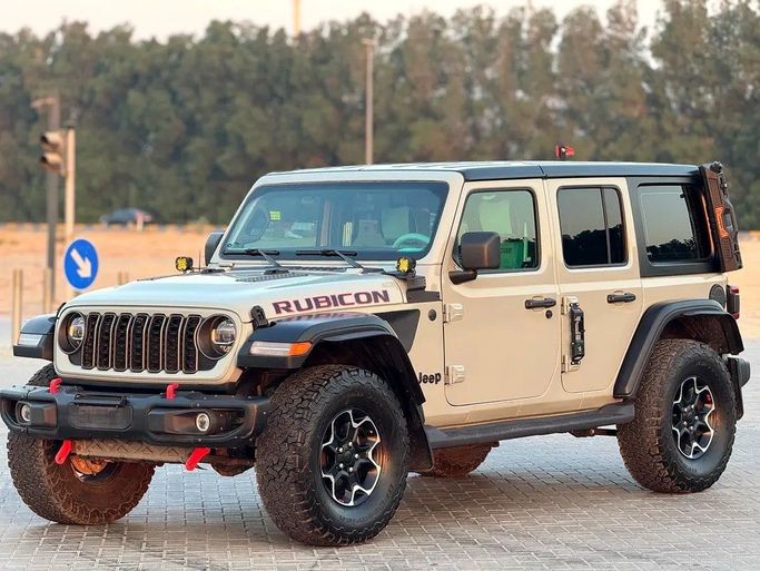 Used Jeep Wrangler IV (JL), 2.0 l, 2023 in Sharjah by Al Ahd Used Cars, Green color. American Specs | AUTO.AE