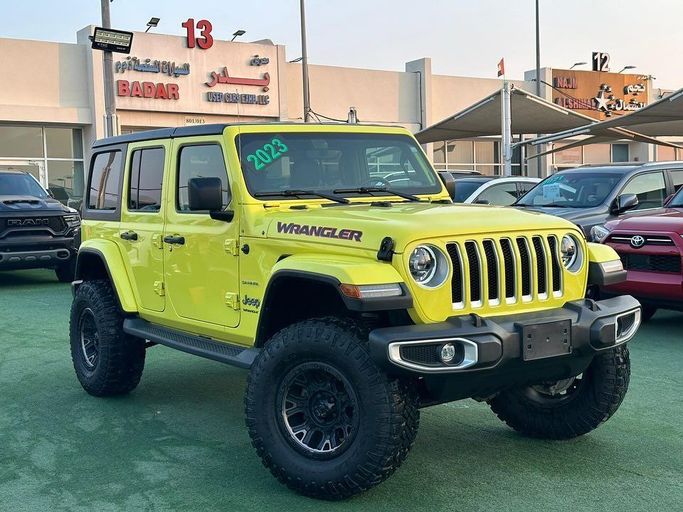 Used Jeep Wrangler IV (JL), 2.0 l, 2023 in Sharjah by Badar Used Cars, Yellow color.  | AUTO.AE
