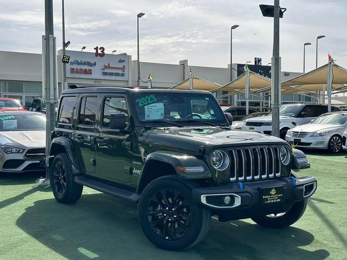 Used Jeep Wrangler IV (JL), 2.0 l, 2023 in Sharjah by Badar Used Cars, Green color.  | AUTO.AE