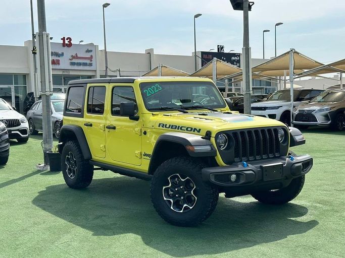 Used Jeep Wrangler IV (JL), 2.0 l, 2023 in Sharjah by Badar Used Cars, Yellow color.  | AUTO.AE
