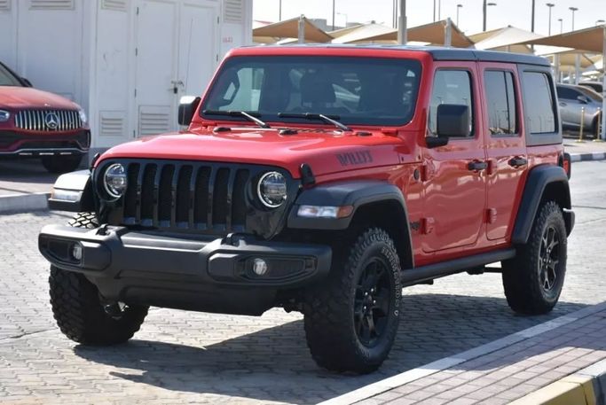 Подержанный Jeep Wrangler IV (JL), 2.0 л, 2021 в Шардже от Alfaris Used Cars Красный цвет. Other | AUTO.AE