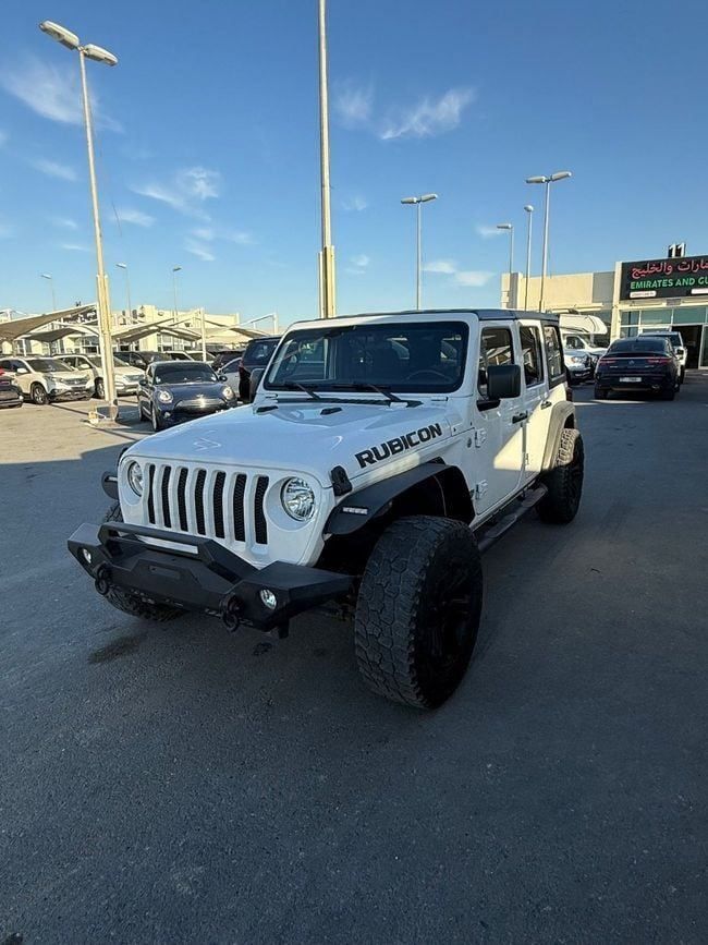 Used Jeep Wrangler IV (JL), 3.6 l, 2020 in Sharjah by Emirates & Gulf used cars, White color. American Specs | AUTO.AE